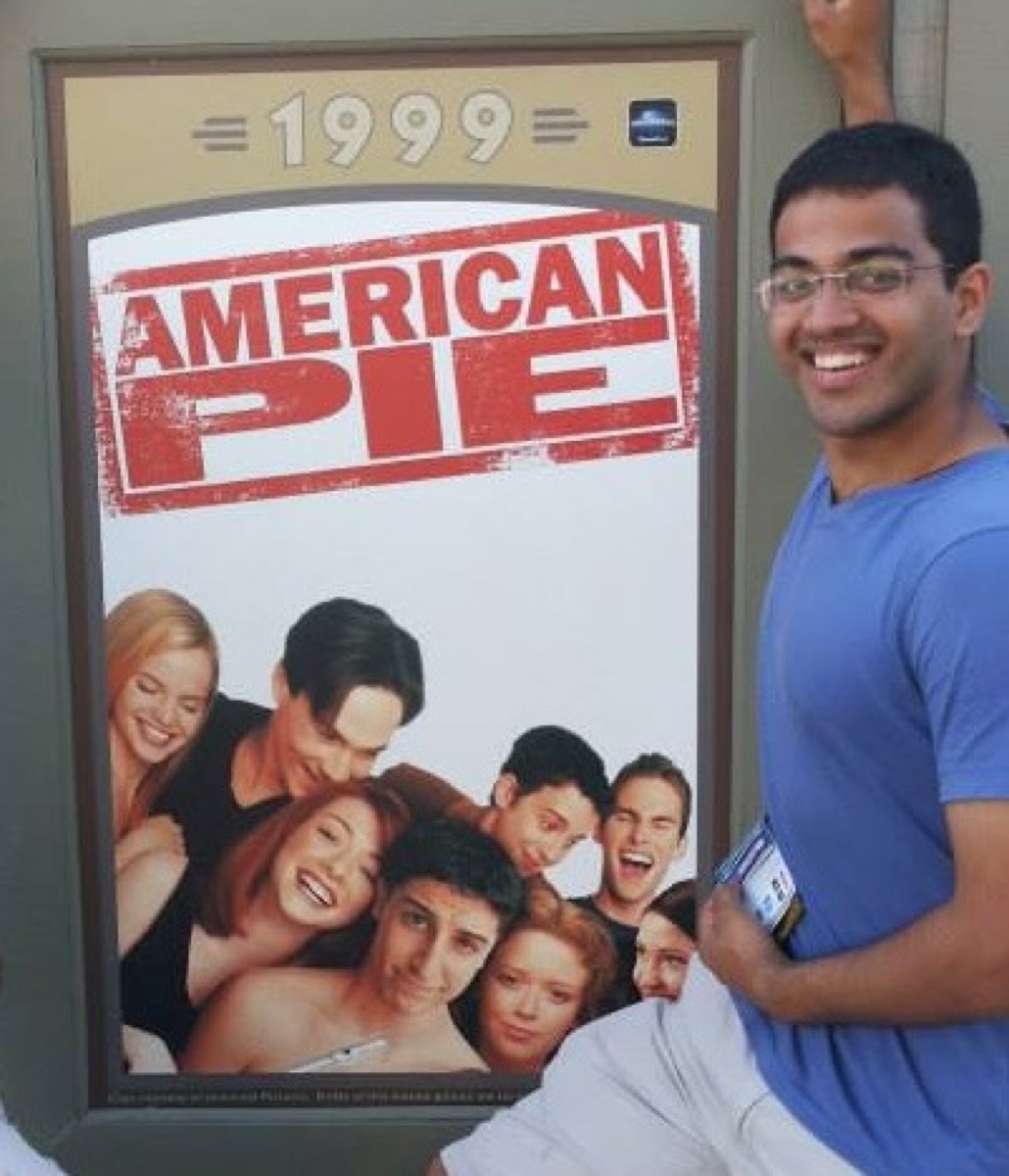 Rohith posing next to an American Pie 1999 poster